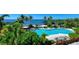 Inviting resort-style pool with plenty of lounge chairs and waterfront views at 311 Compass Point Dr # 201, Bradenton, FL 34209