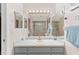 Bathroom with vanity, sink, and large mirror at 339 Rio De Janeiro Ave, Punta Gorda, FL 33983