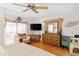 Main bedroom with sliding glass doors, large dresser and seating area at 339 Rio De Janeiro Ave, Punta Gorda, FL 33983