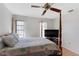 Comfortable bedroom with a post bed and large TV at 339 Rio De Janeiro Ave, Punta Gorda, FL 33983