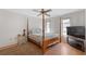 Spacious bedroom with a post bed and large TV at 339 Rio De Janeiro Ave, Punta Gorda, FL 33983