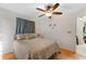 Comfortable bedroom with a ceiling fan and large window at 339 Rio De Janeiro Ave, Punta Gorda, FL 33983