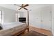 Bright bedroom with a queen-size bed, wood floors, and a ceiling fan at 339 Rio De Janeiro Ave, Punta Gorda, FL 33983
