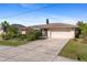 Single-story home with attached garage and landscaped front yard at 339 Rio De Janeiro Ave, Punta Gorda, FL 33983