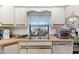 Kitchen with double sink, dishwasher, and ample counter space at 339 Rio De Janeiro Ave, Punta Gorda, FL 33983