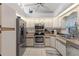 Kitchen with stainless steel appliances and light wood cabinets at 339 Rio De Janeiro Ave, Punta Gorda, FL 33983