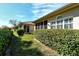 Private backyard with lush landscaping and a view of neighboring homes at 3416 W Chelmsford Ct # 2, Sarasota, FL 34235