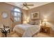 Bright bedroom with a comfortable queen-size bed and wood floors at 3416 W Chelmsford Ct # 2, Sarasota, FL 34235