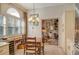 Charming breakfast nook with built-in cabinetry and view into the living room at 3416 W Chelmsford Ct # 2, Sarasota, FL 34235