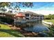 Clubhouse with patio seating overlooking a pond at 3416 W Chelmsford Ct # 2, Sarasota, FL 34235