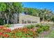 The Meadows community entrance with stone signage and landscaping at 3416 W Chelmsford Ct # 2, Sarasota, FL 34235