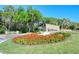 The Meadows community entrance features a stone sign and landscaping at 3416 W Chelmsford Ct # 2, Sarasota, FL 34235