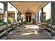 Community walkway with benches leading to clubhouse at 3416 W Chelmsford Ct # 2, Sarasota, FL 34235