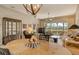 Elegant dining area with a large table and access to the living room at 3416 W Chelmsford Ct # 2, Sarasota, FL 34235