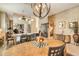 Formal dining room showcasing a large chandelier and a view to the living room at 3416 W Chelmsford Ct # 2, Sarasota, FL 34235