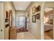Light and airy entryway showcasing artwork and access to other rooms at 3416 W Chelmsford Ct # 2, Sarasota, FL 34235