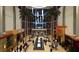 Mall interior with high ceilings, palm trees, and restaurants at 3416 W Chelmsford Ct # 2, Sarasota, FL 34235