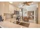Modern kitchen with stainless steel appliances and white cabinetry at 3416 W Chelmsford Ct # 2, Sarasota, FL 34235