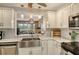 Updated kitchen featuring a farmhouse sink and breakfast bar at 3416 W Chelmsford Ct # 2, Sarasota, FL 34235