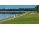 Paved path alongside a lake with markers at 3416 W Chelmsford Ct # 2, Sarasota, FL 34235