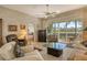 Comfortable living room with a relaxing atmosphere and golf course views at 3416 W Chelmsford Ct # 2, Sarasota, FL 34235