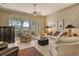 Relaxing living room with comfortable seating and access to a patio at 3416 W Chelmsford Ct # 2, Sarasota, FL 34235