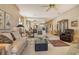 Bright living room with ample seating and access to the dining area at 3416 W Chelmsford Ct # 2, Sarasota, FL 34235