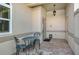 Small patio with wrought iron furniture and brick pavers at 3416 W Chelmsford Ct # 2, Sarasota, FL 34235