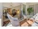 Relaxing patio with wicker furniture, offering access to the living room at 3416 W Chelmsford Ct # 2, Sarasota, FL 34235