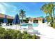 Community pool and patio area with ample seating at 3416 W Chelmsford Ct # 2, Sarasota, FL 34235