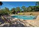 Community swimming pool with plenty of lounge chairs at 3416 W Chelmsford Ct # 2, Sarasota, FL 34235