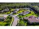 Aerial view showcasing a neighborhood with houses and a pond at 348 165Th Ne Ct, Bradenton, FL 34212