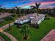 Single-story home with tile roof, landscaping, and pool at 348 165Th Ne Ct, Bradenton, FL 34212