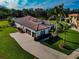 Aerial view of home with tile roof, driveway, and landscaping at 348 165Th Ne Ct, Bradenton, FL 34212
