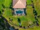 Aerial view of house, pool, and expansive green lawn at 348 165Th Ne Ct, Bradenton, FL 34212