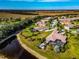 Two houses next to a pond, one with a pool and large backyard at 348 165Th Ne Ct, Bradenton, FL 34212