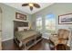 Guest bedroom with wood flooring and large windows at 348 165Th Ne Ct, Bradenton, FL 34212