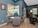 Cozy breakfast nook with a round glass table and gray velvet chairs at 348 165Th Ne Ct, Bradenton, FL 34212