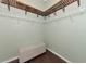 Spacious walk-in closet with custom shelving and bench at 348 165Th Ne Ct, Bradenton, FL 34212
