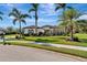 Single-story home with lush landscaping and palm trees at 348 165Th Ne Ct, Bradenton, FL 34212