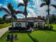 Exterior view of a single-story house with palm trees at 348 165Th Ne Ct, Bradenton, FL 34212