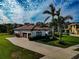 Single-story home with tile roof, attached garage, and lush landscaping at 348 165Th Ne Ct, Bradenton, FL 34212