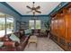 Cozy Gathering room with leather sofas and built-in shelving at 348 165Th Ne Ct, Bradenton, FL 34212
