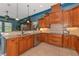 Well-equipped kitchen with wood cabinets and granite countertops at 348 165Th Ne Ct, Bradenton, FL 34212