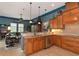 Kitchen with wood cabinets, granite counters, and stainless steel appliances at 348 165Th Ne Ct, Bradenton, FL 34212