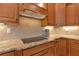 Kitchen with granite countertop and gas cooktop at 348 165Th Ne Ct, Bradenton, FL 34212