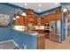 Open kitchen with granite counters and stainless steel appliances at 348 165Th Ne Ct, Bradenton, FL 34212