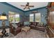 Relaxing living room with a large sectional sofa and built-in shelving at 348 165Th Ne Ct, Bradenton, FL 34212