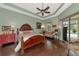 Main bedroom with wood floors and access to the pool at 348 165Th Ne Ct, Bradenton, FL 34212