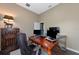 Home office with wood desk and two computer monitors at 348 165Th Ne Ct, Bradenton, FL 34212